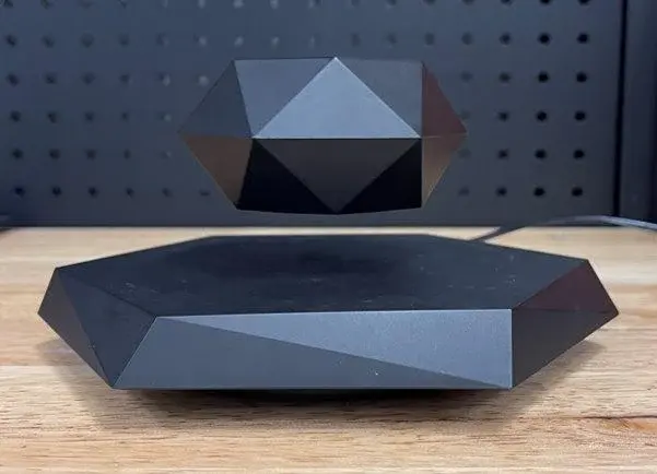 Floating pot above its magnetic levitation base